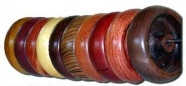 Row of big bossie spindles in different woods